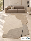 Basel Paper Memory: hand-tufted wool rug in parchment, oat beige, pale stone grey and black, in a modern living room with coordinated art.
