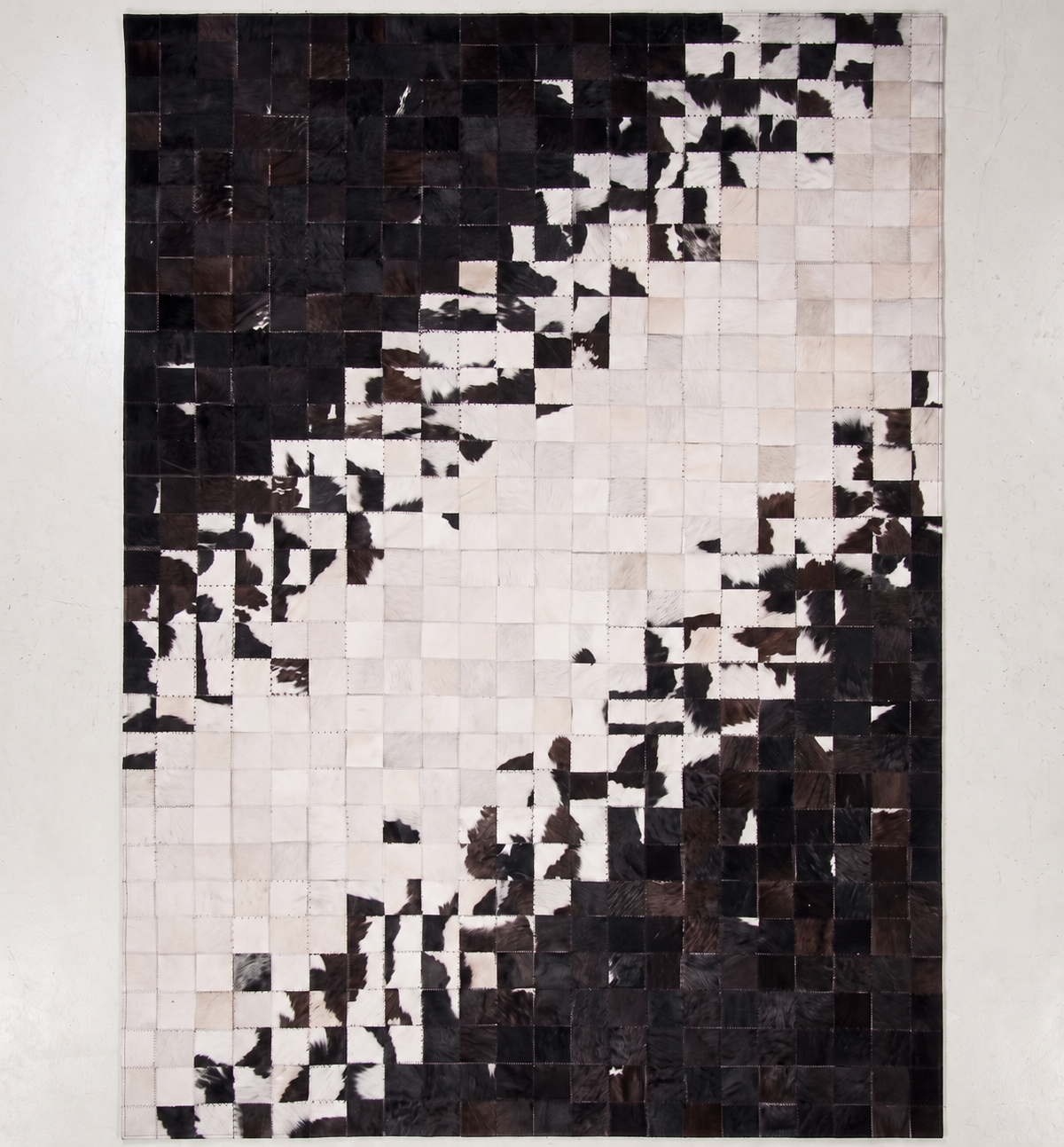 Pixel Flow – Patchwork leather rug in black & white
