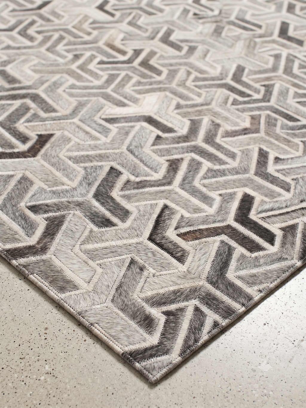 Trinity – Geometric patchwork leather rug