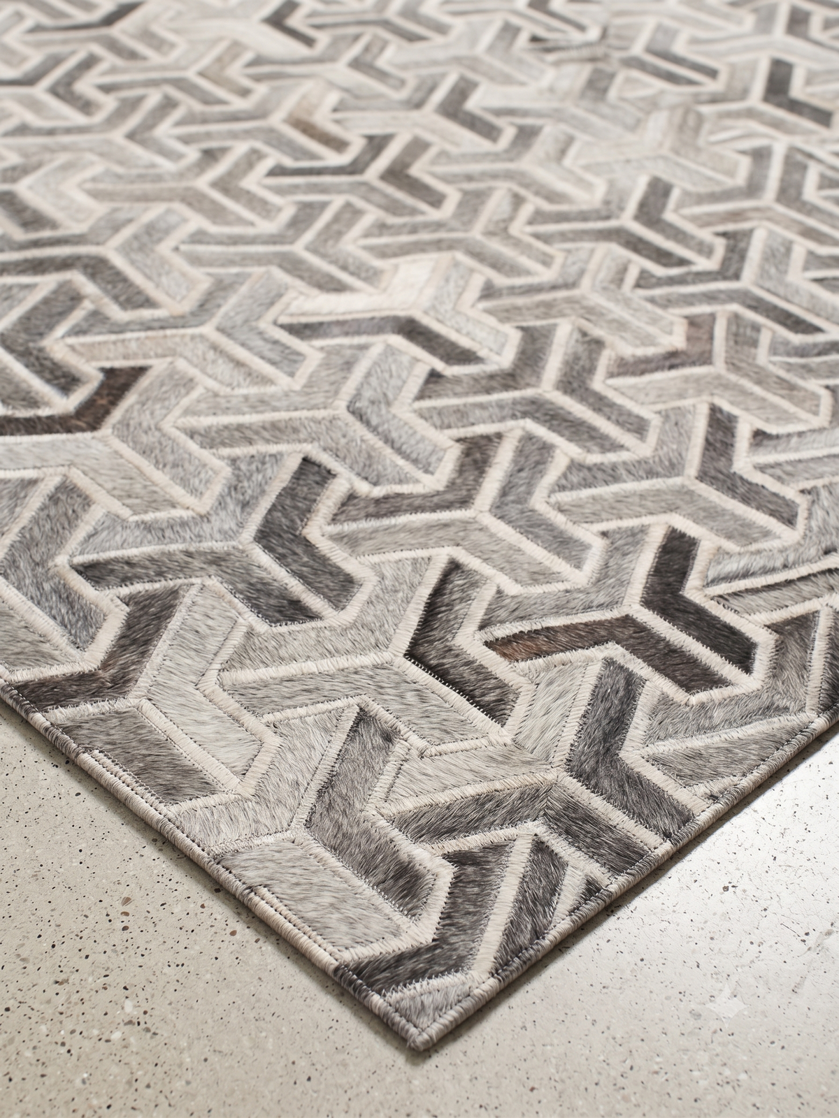 Trinity – Geometric patchwork leather rug