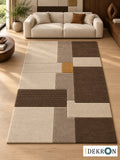 Zurich Guild Rhythm: hand-tufted wool rug in ivory, mushroom beige, walnut brown and muted golden yellow, in a modern living room with coordinated art.