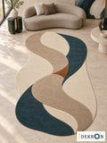 Zurich Silk Current: hand-tufted wool rug in ivory, flax beige, taupe, deep teal and tobacco brown, in a modern living room with coordinated art.