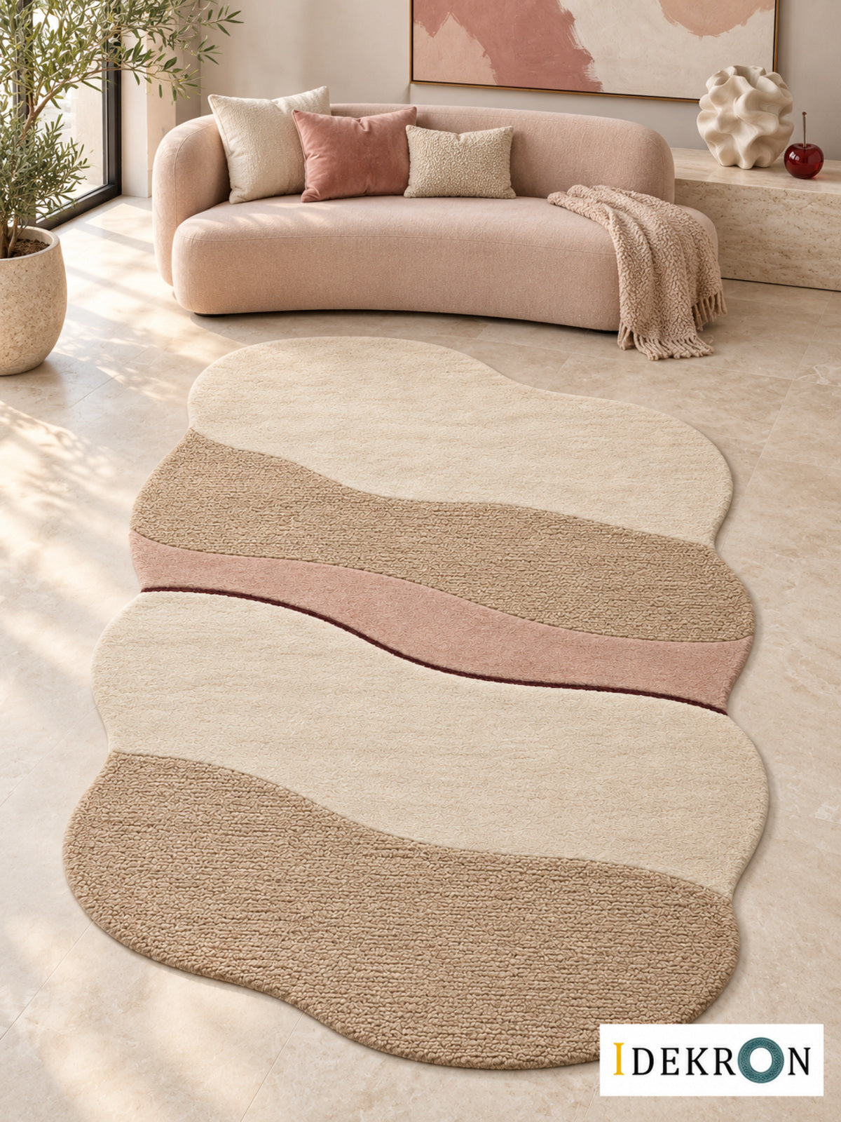 Zug Kirsch Layers: hand-tufted wool rug in cream, biscuit beige, dusty rose and dark cherry red, in a modern living room with coordinated art.